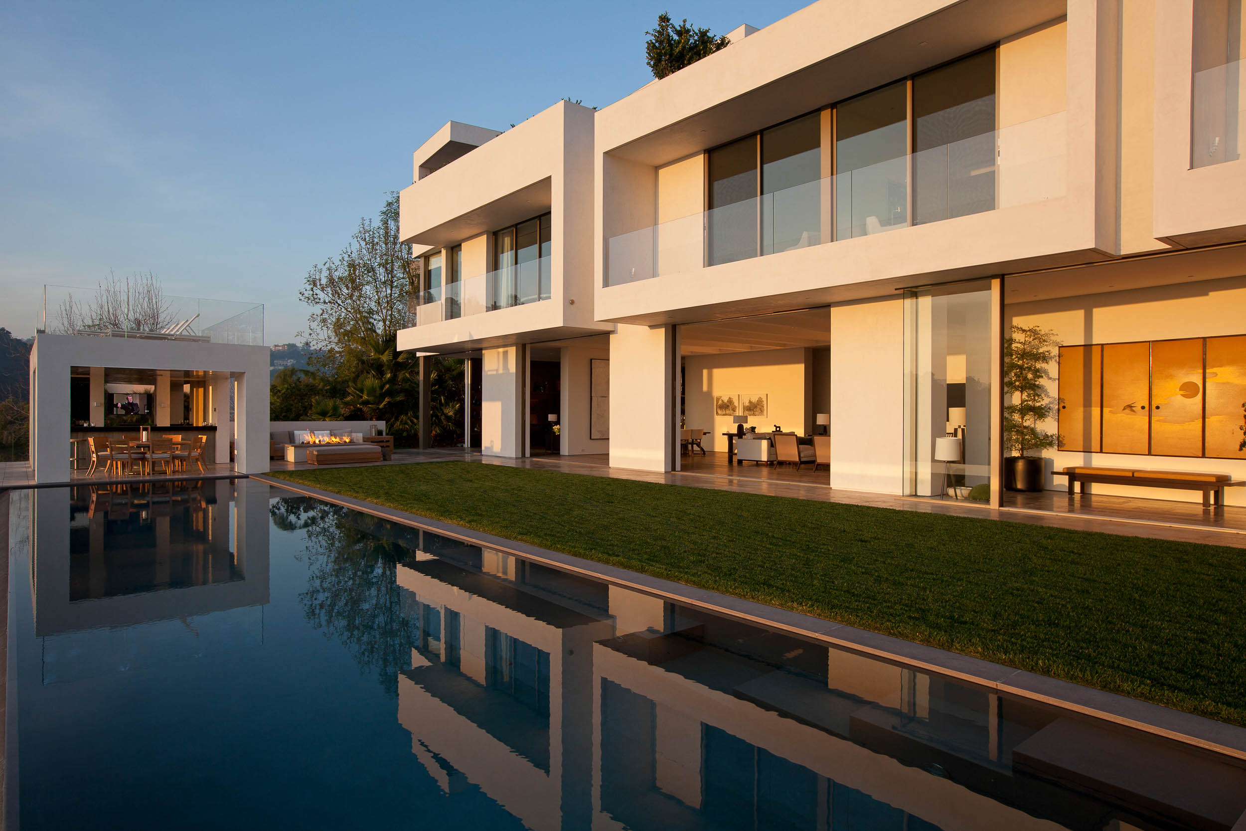 modern house with open dining room overlooking pool