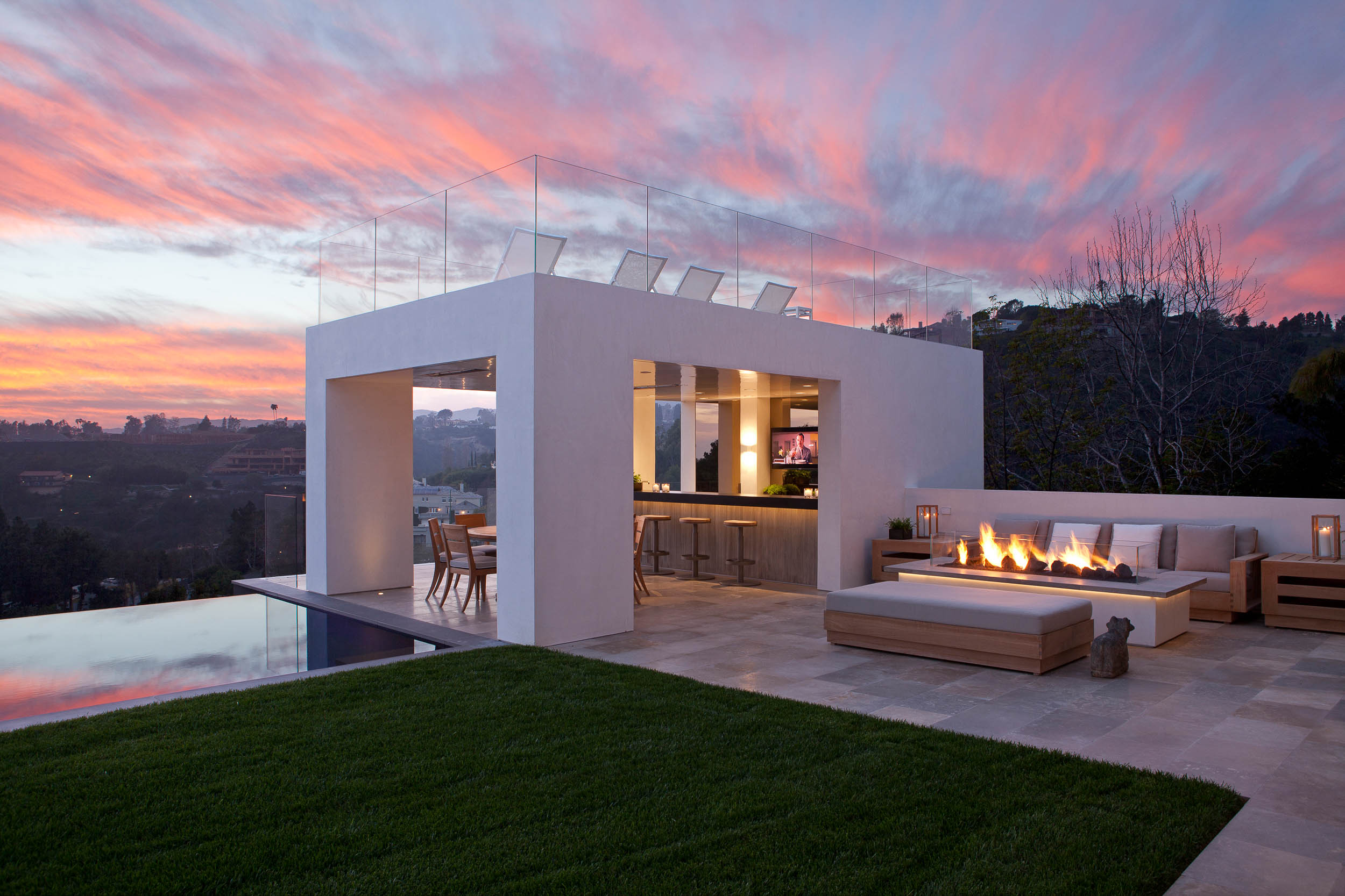 outdoor pavilion next to lounge area with sunset