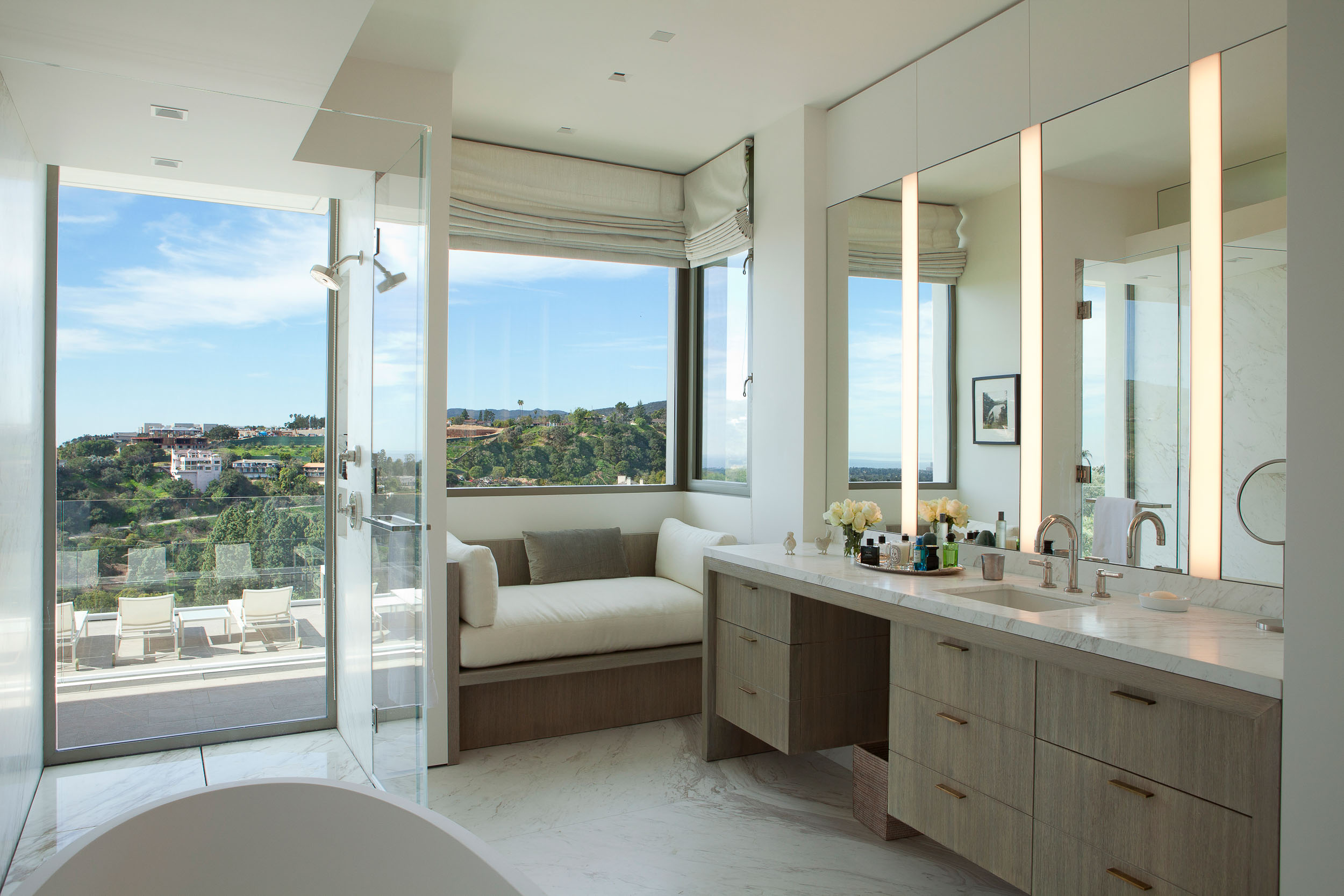 master bathroom overlooking lounge chairs