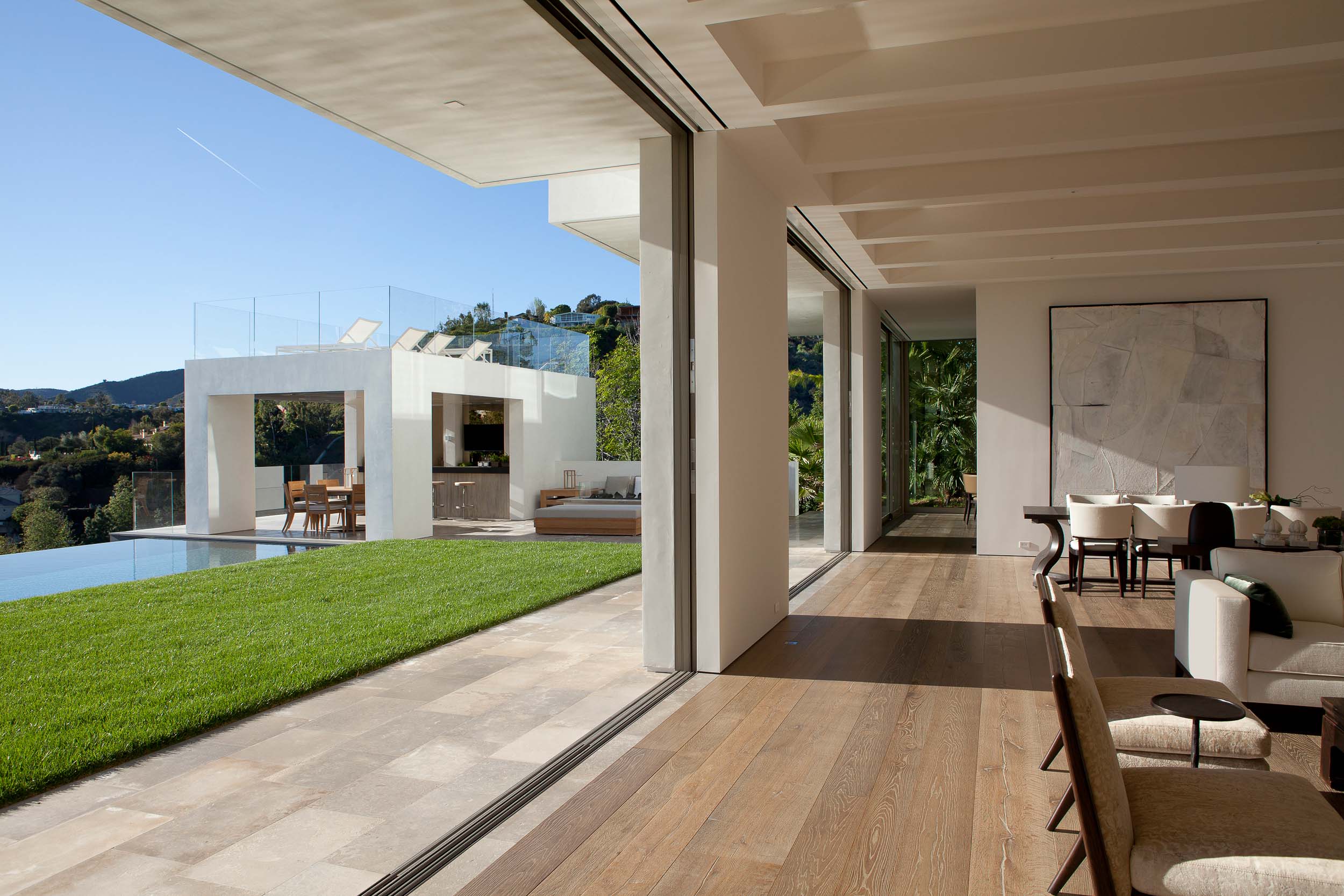 modern interior opens onto backyard and infinity pool