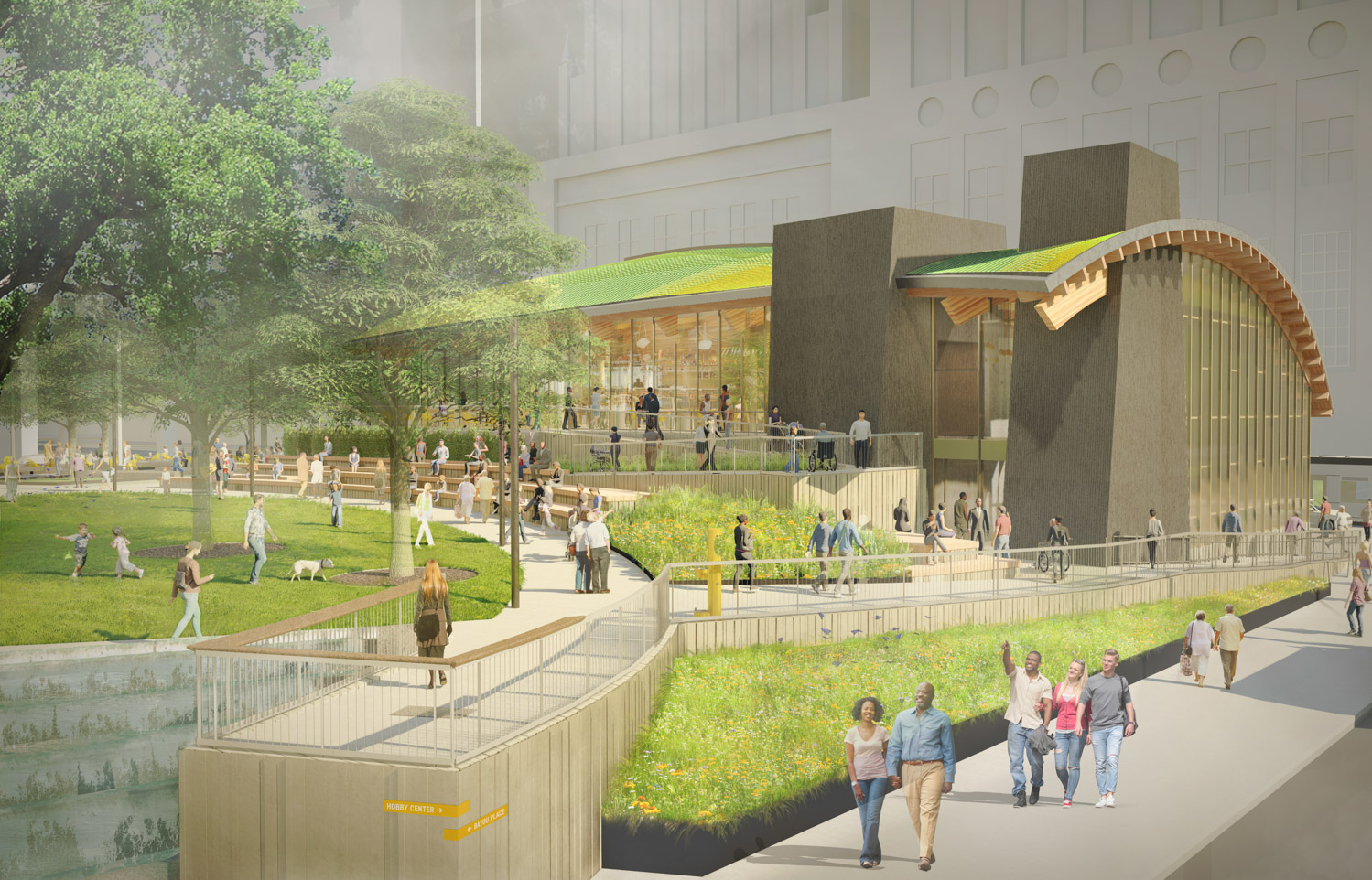 Street view of Lynn Wyatt Square with people walking through the pathways and children playing in the grass
