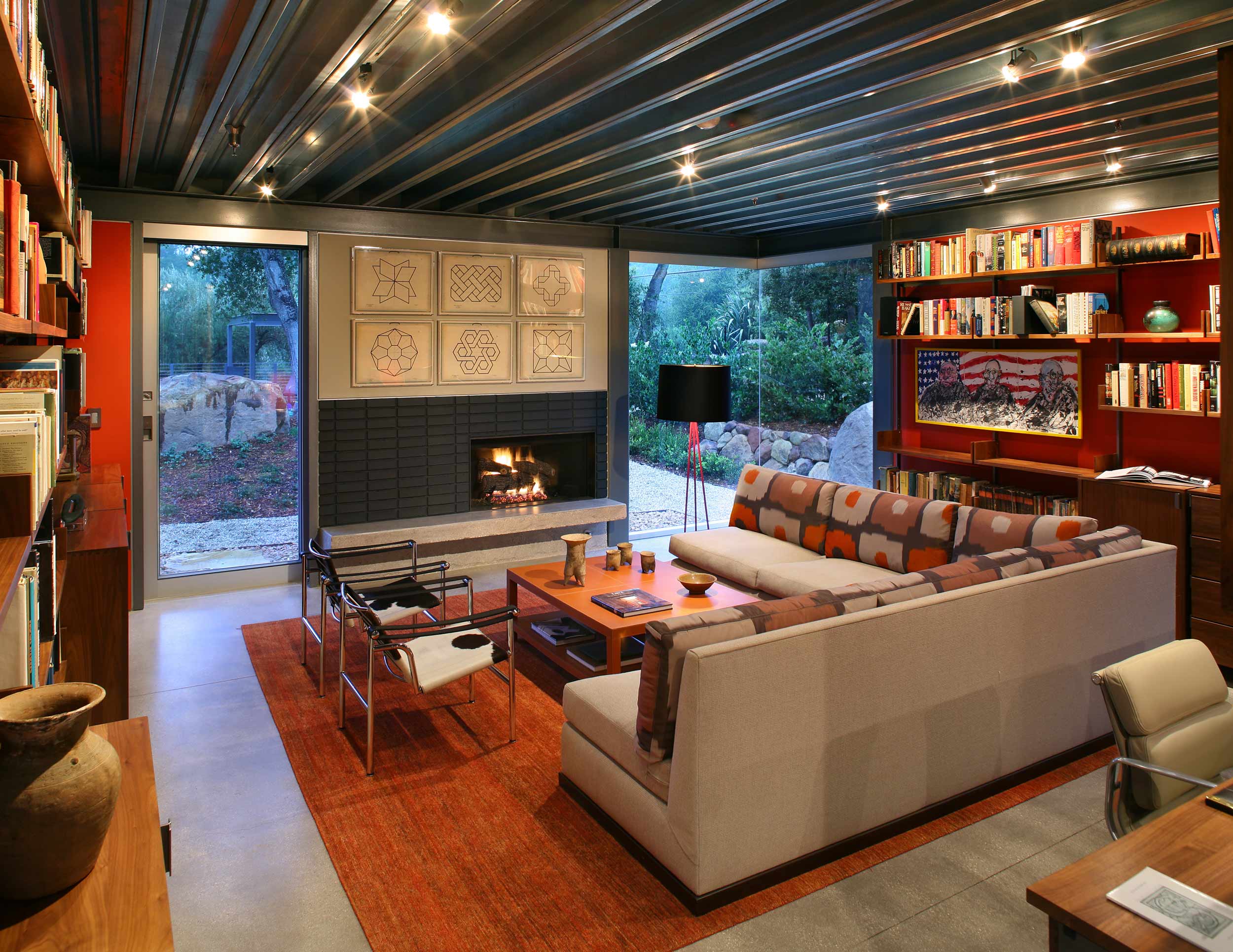 living room with red walls and fireplace