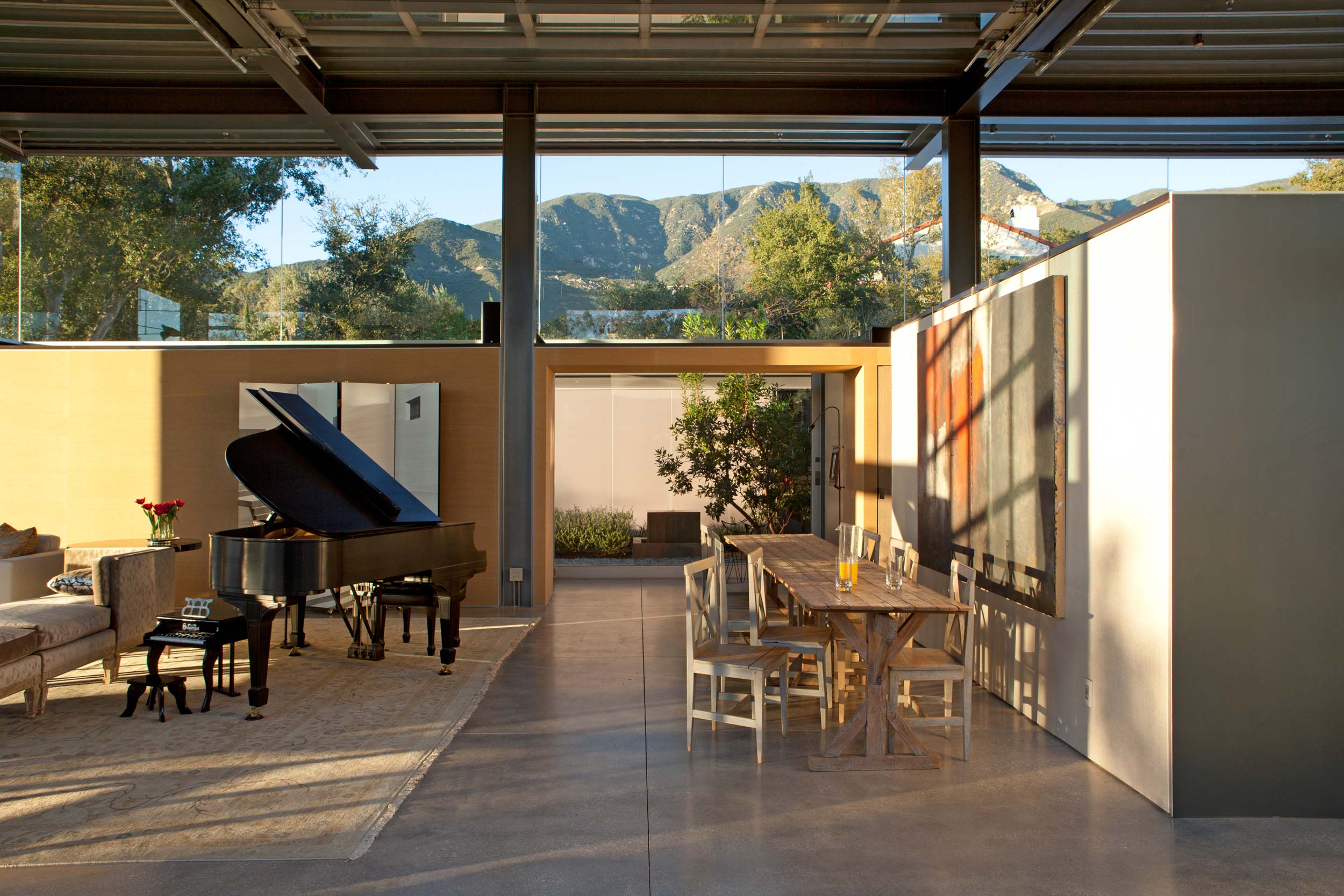 open interior with piano and mountain view