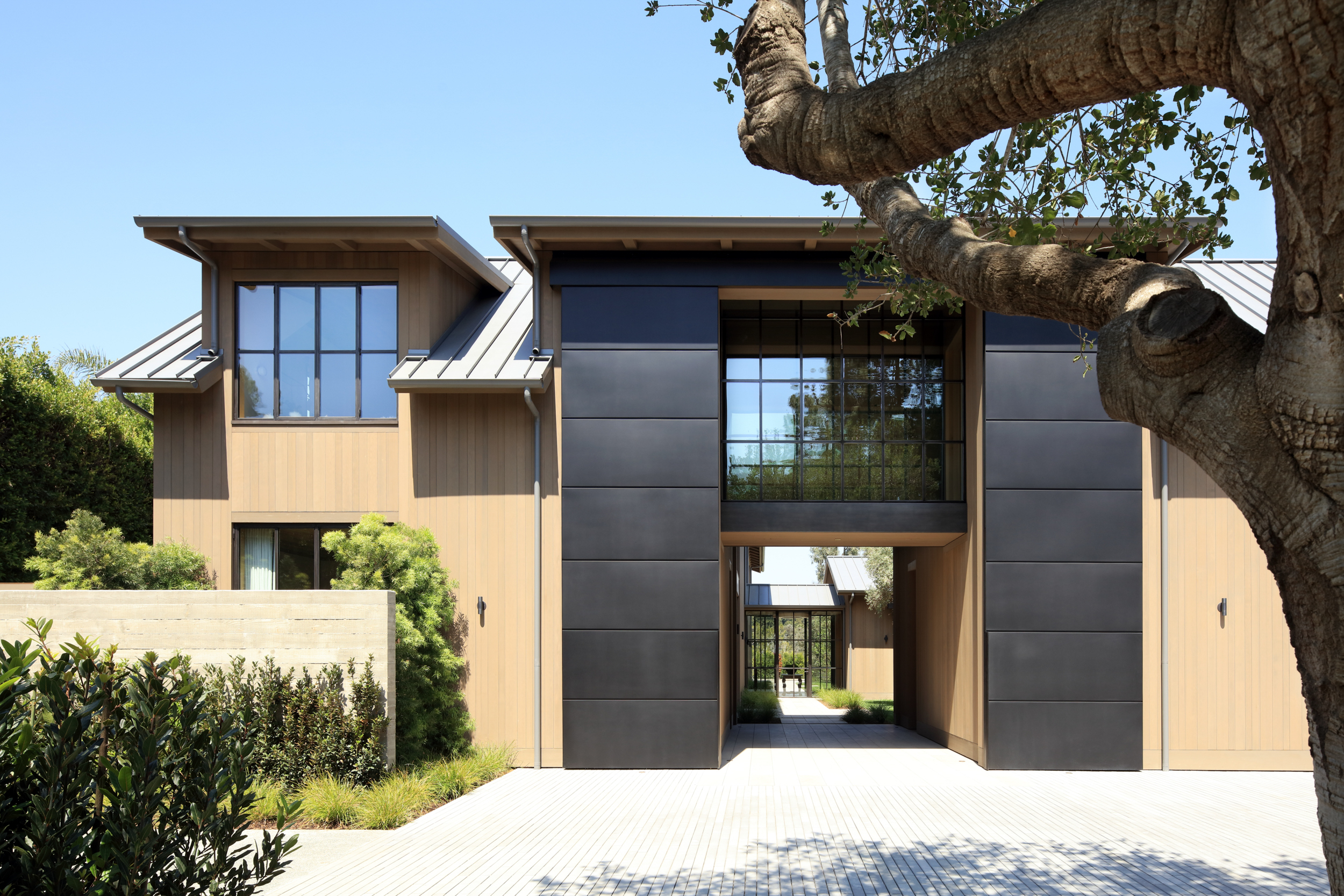 modern home entrance looking through to courtyard