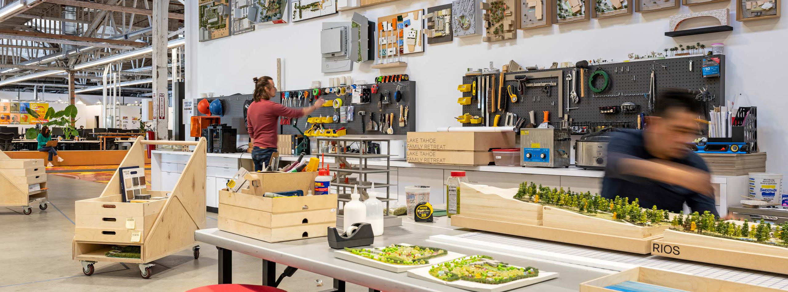 man making an architectural model in the Expo maker space