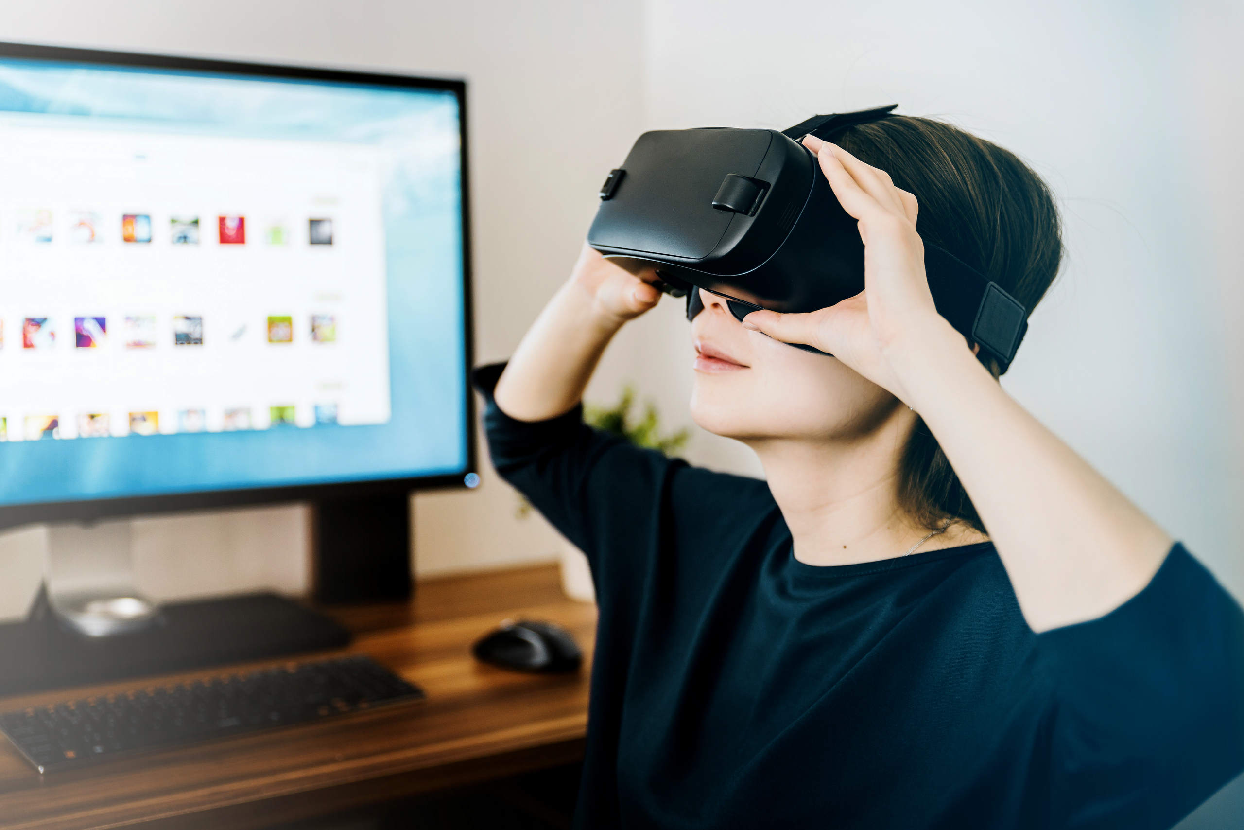 woman looking through VR goggles