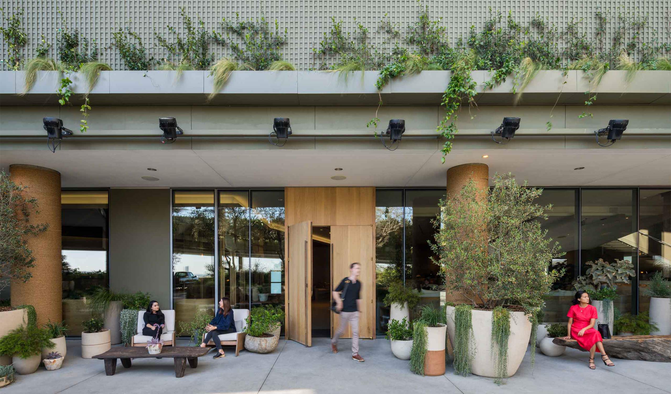 hotel entrance with seating and plants