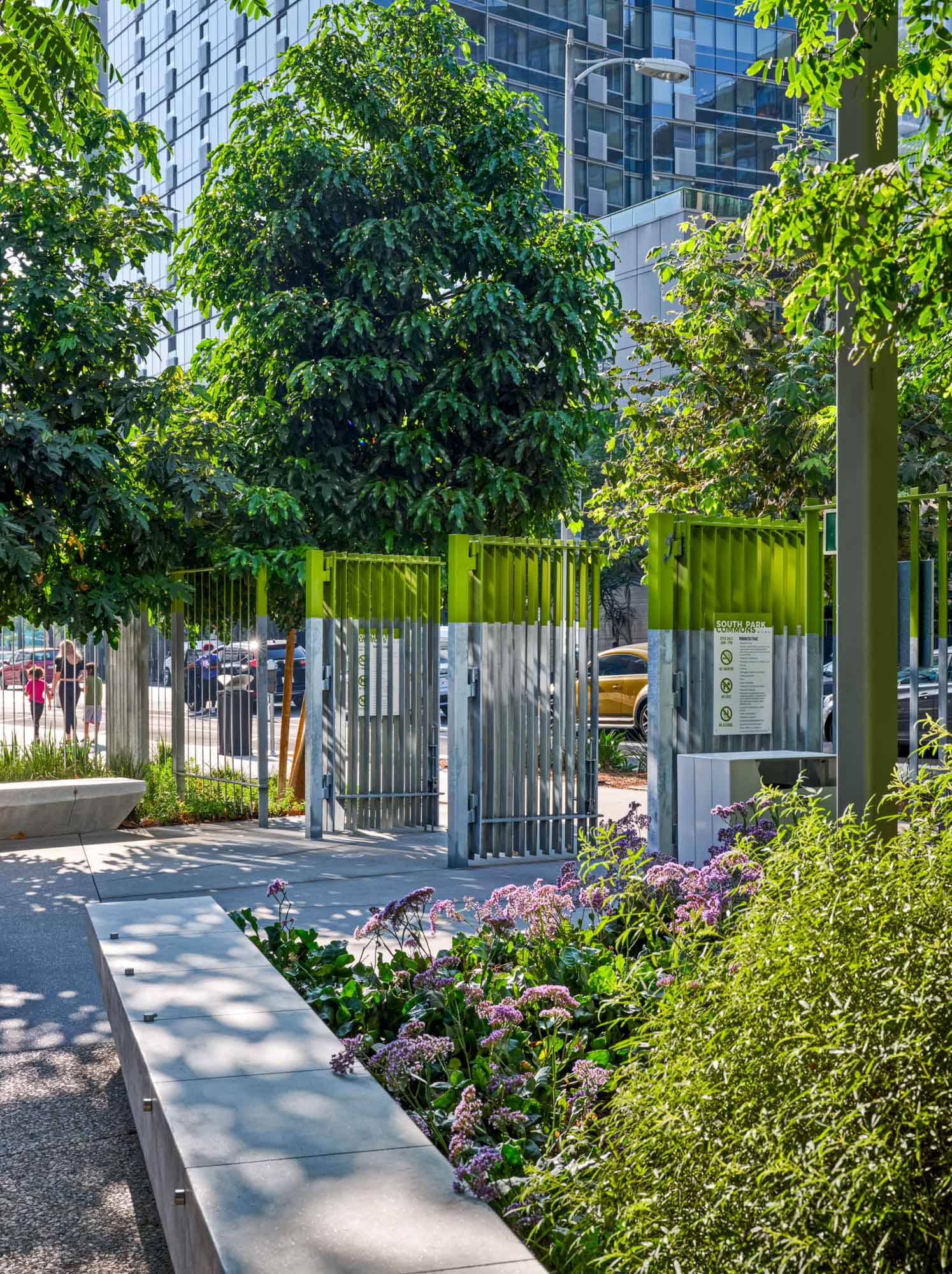 gates to south park commons surrounded by bushes and trees