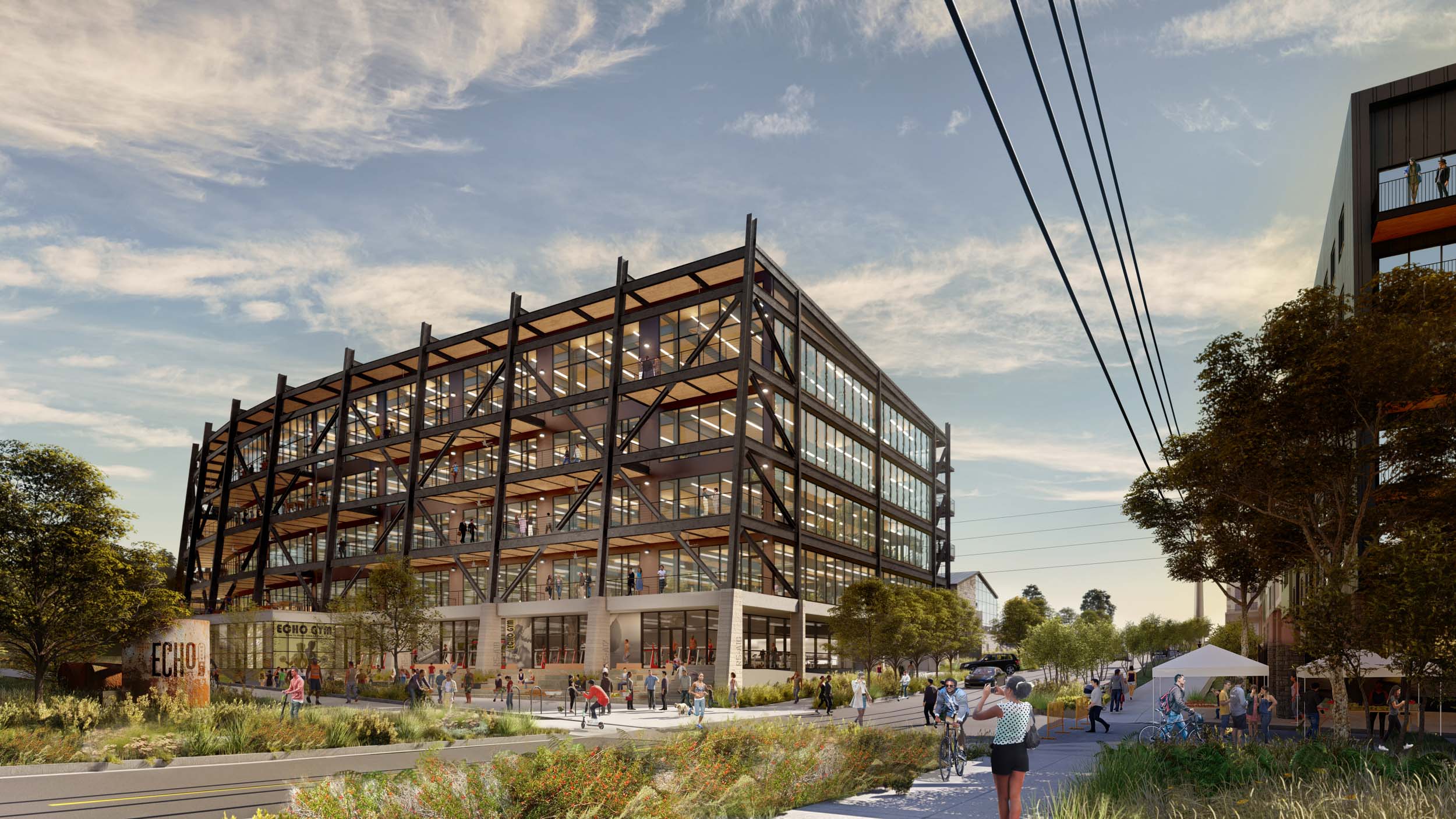 industrial building facade with trees and pathways and people