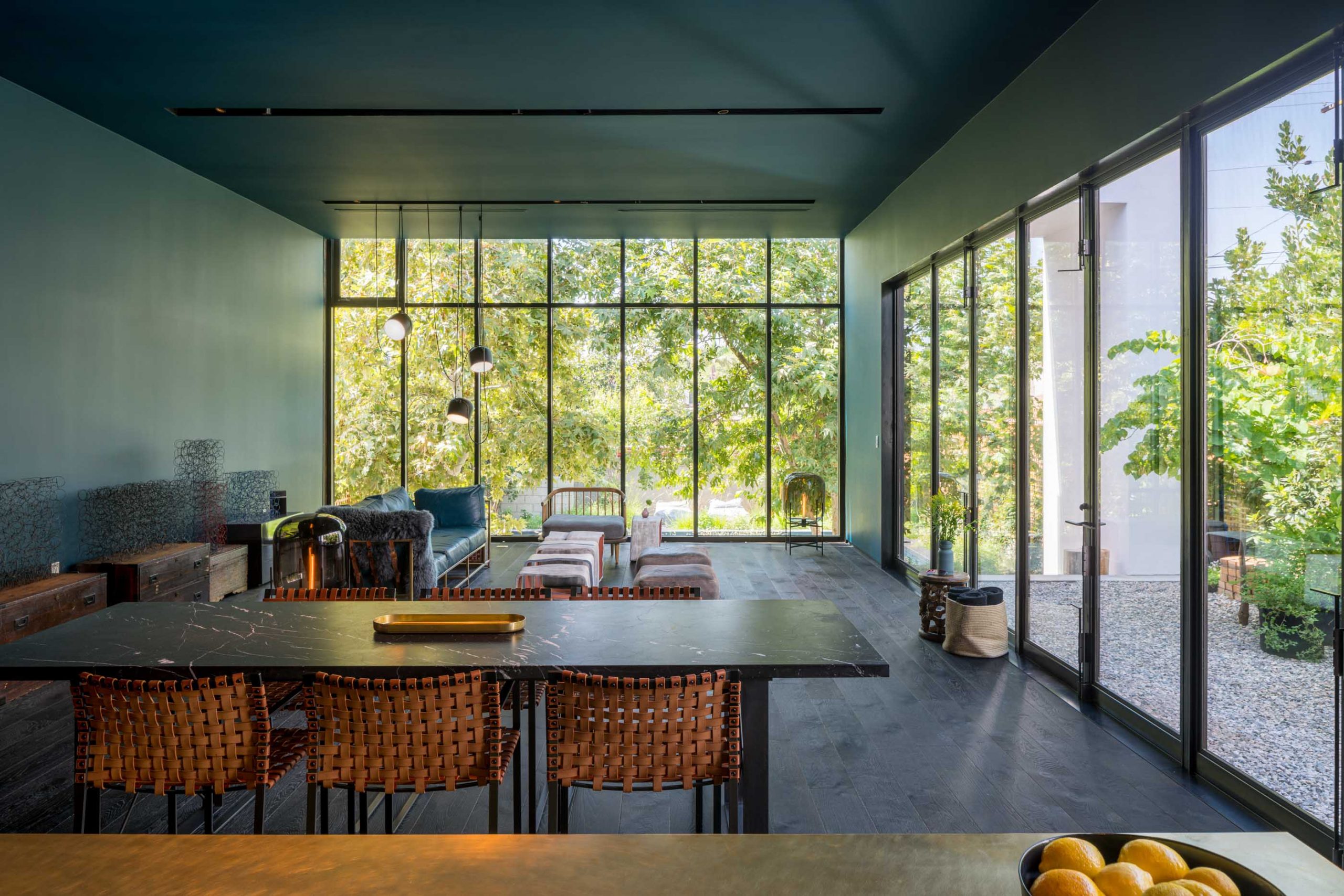 modern bungalow living room with kitchen table and large window