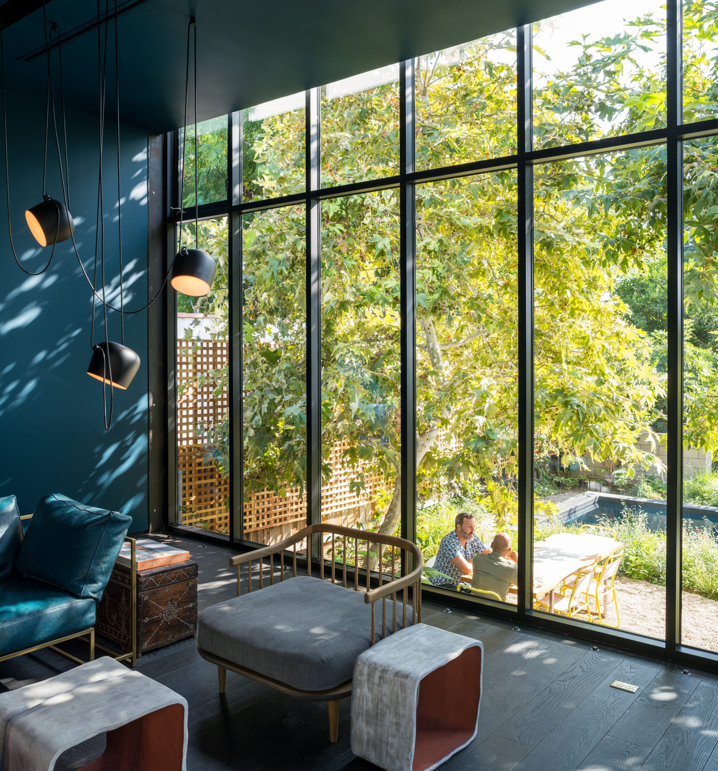 blue wall with view to outdoor tree and table