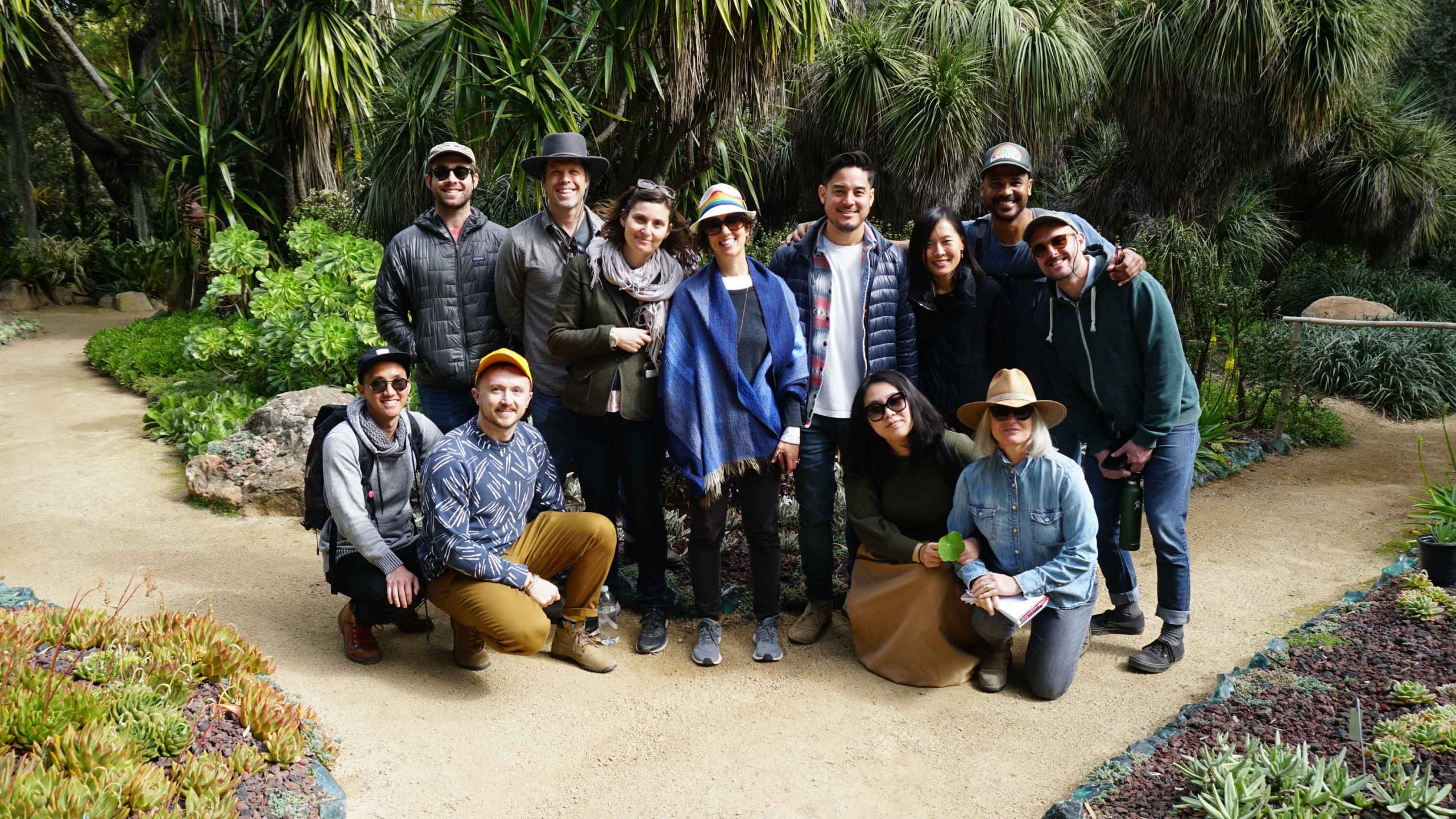 Landscape team gathered for group photo in front of landscaping at Lotusland