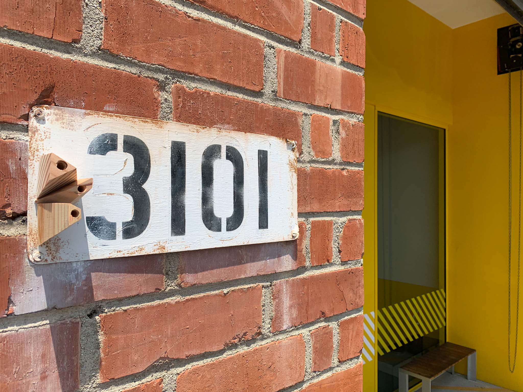 small bug hotel in front of warehouse entrance