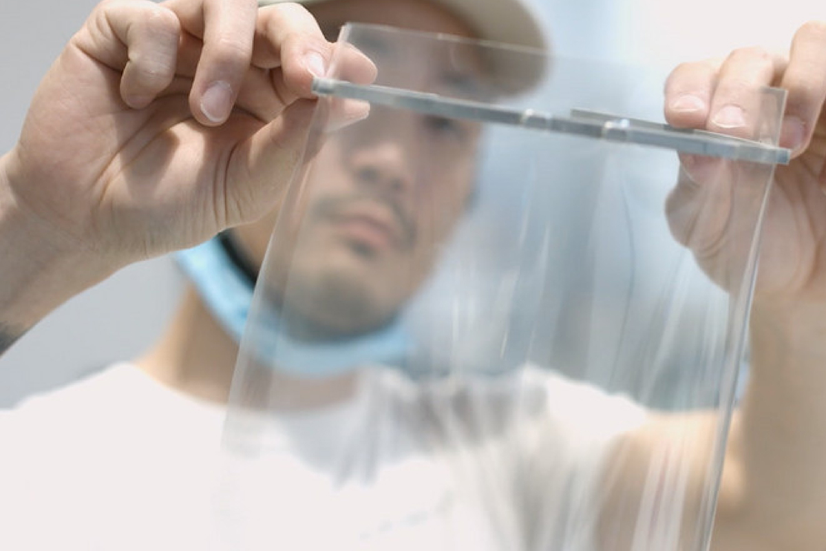 man looking through a clear plastic face shield