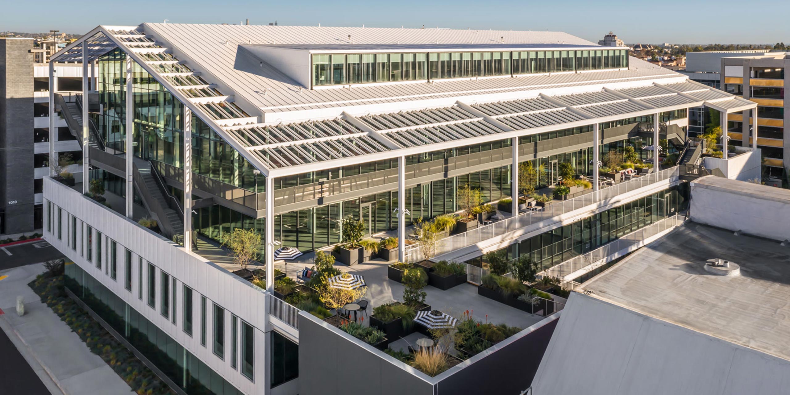 The Harlow creative office showing the balconies and terraces with planters along the exterior.