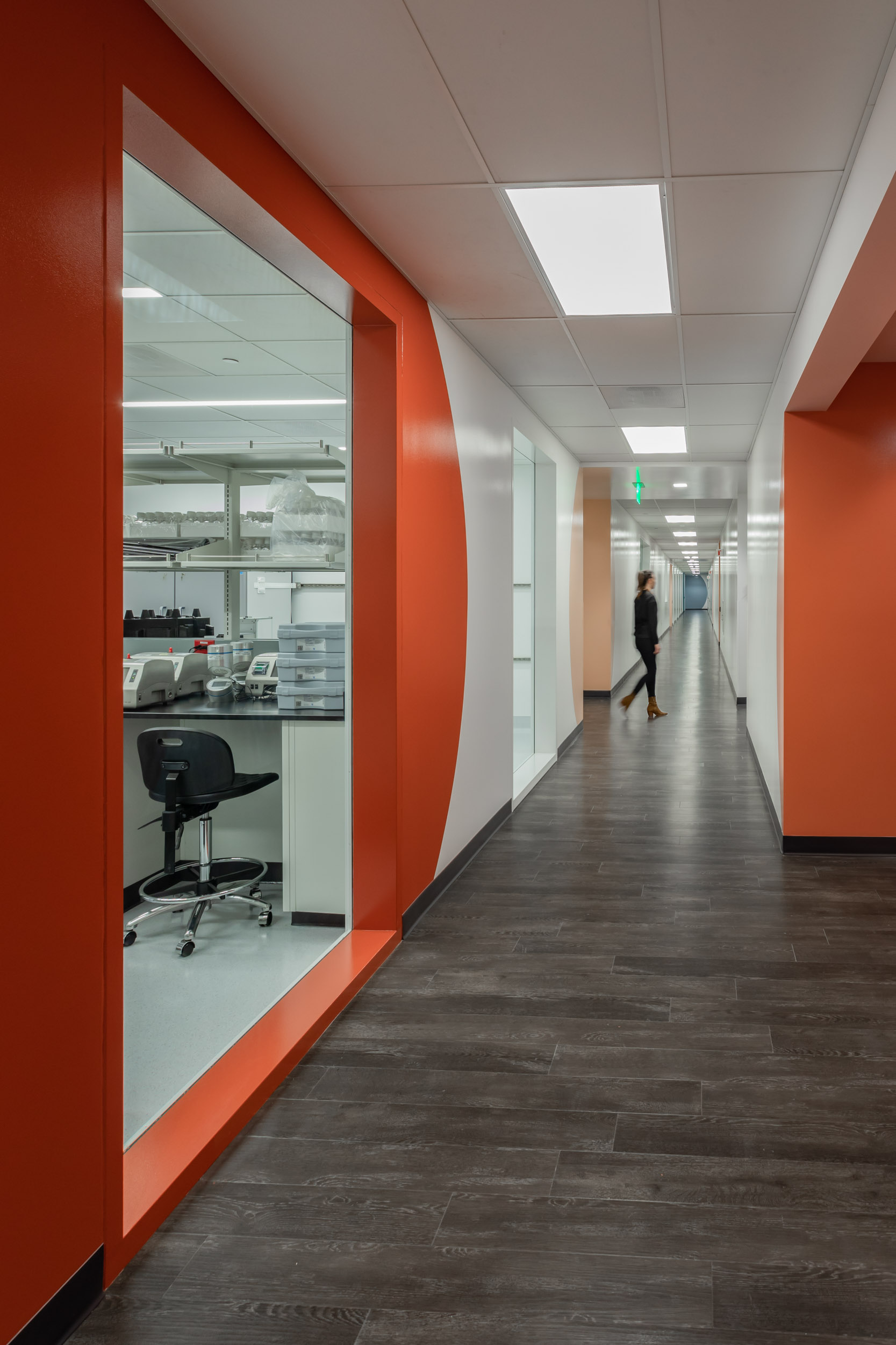 woman walking down the hallway at life science manufacturing facility