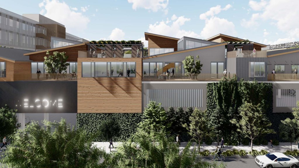 Wood and metal production studio facade surrounded by plants
