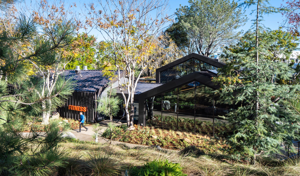 Exterior of the fitness center surrounded by greenery