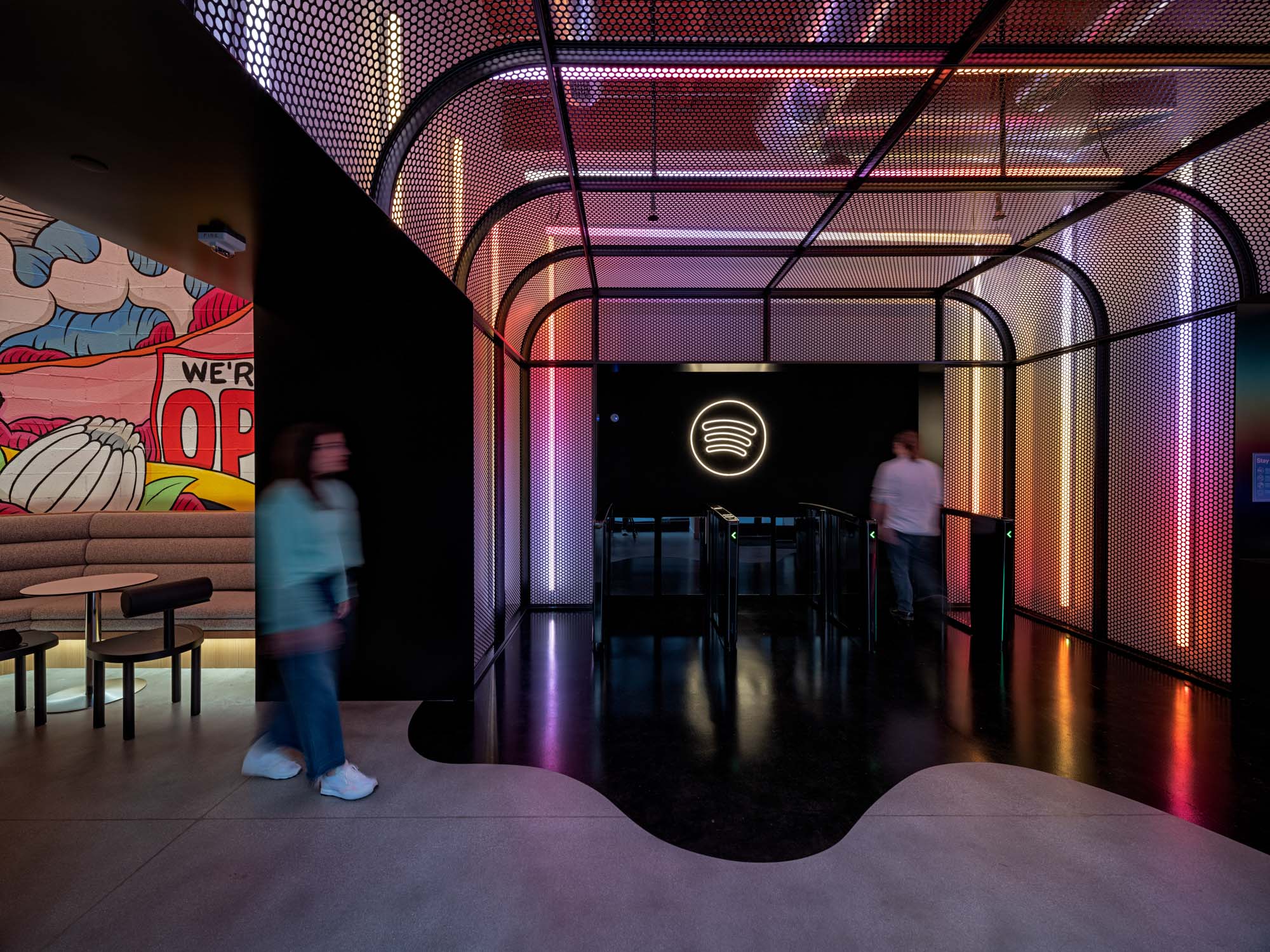 Entry into Spotify headquarters with neon gradient and the Spotify logo