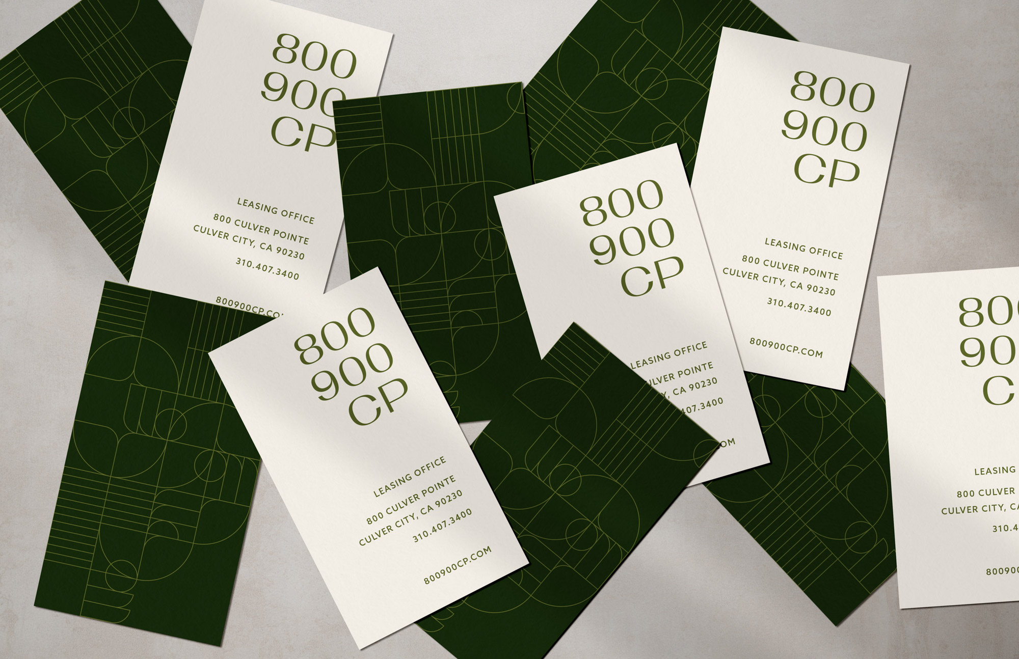 800 900 CP business cards with green pattern on back and contact information on the front