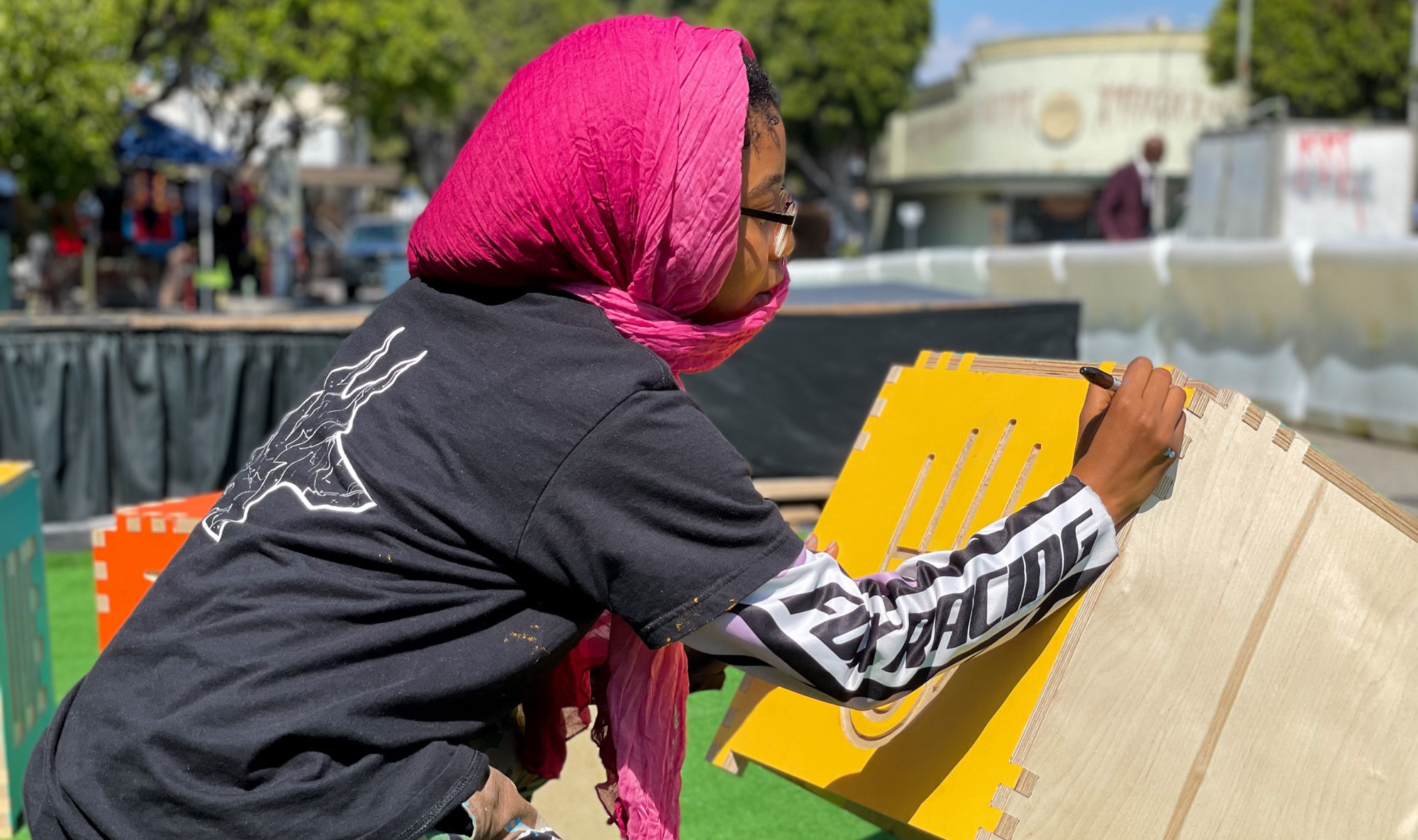 Girl painting a cube