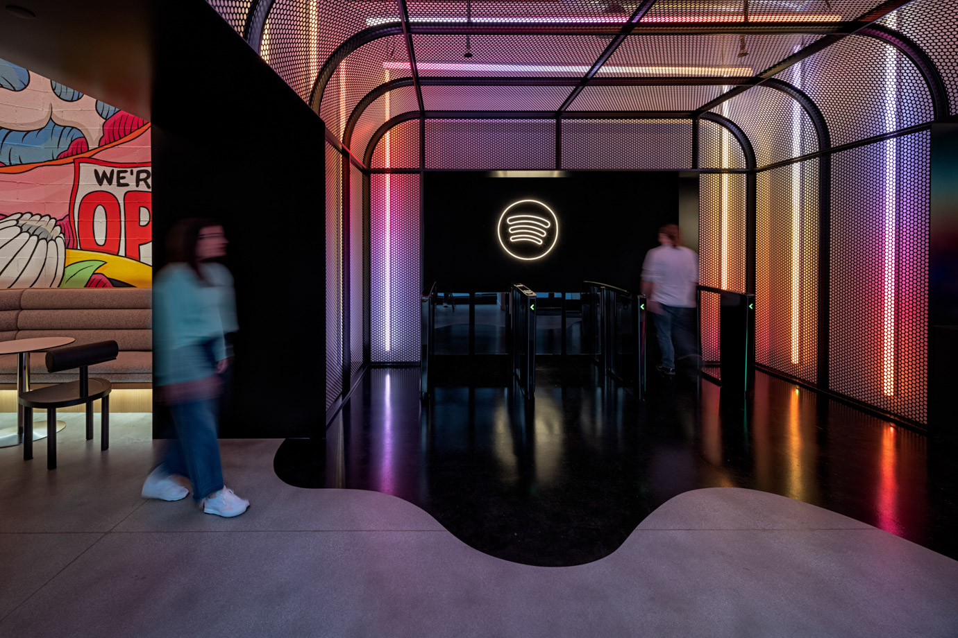 Entry into Spotify headquarters with neon gradient and the Spotify logo