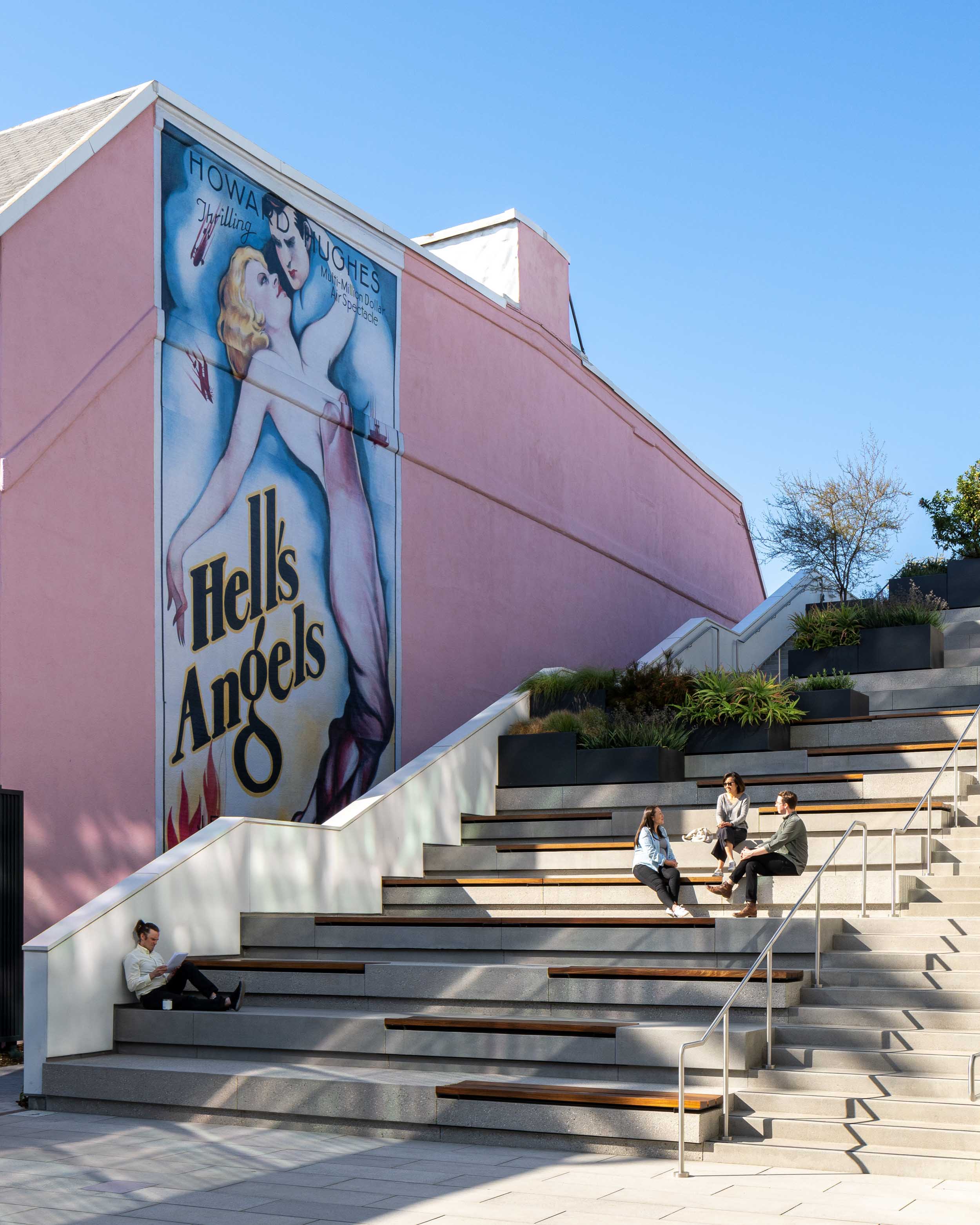 People hanging out along the seated steps at Harlow