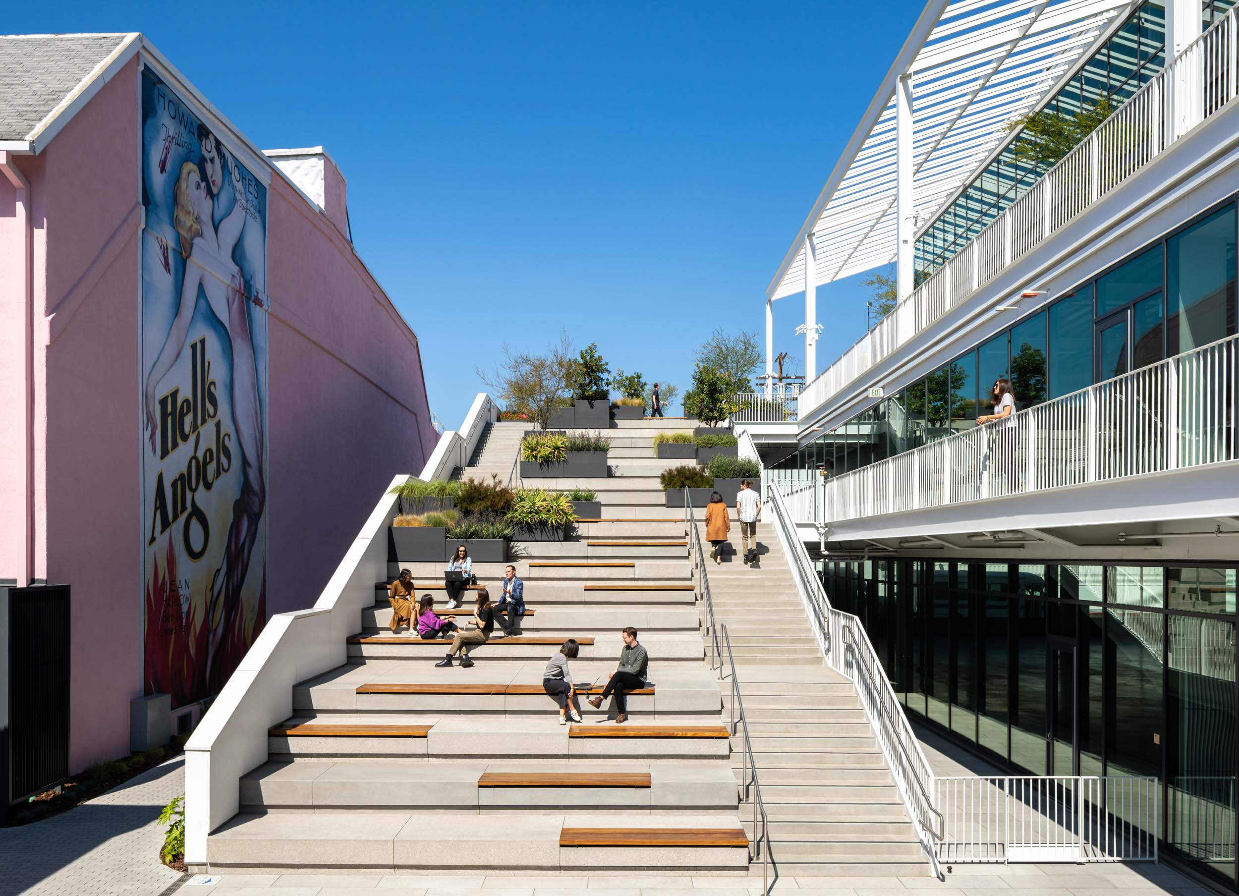 People hanging out along the seated steps at Harlow