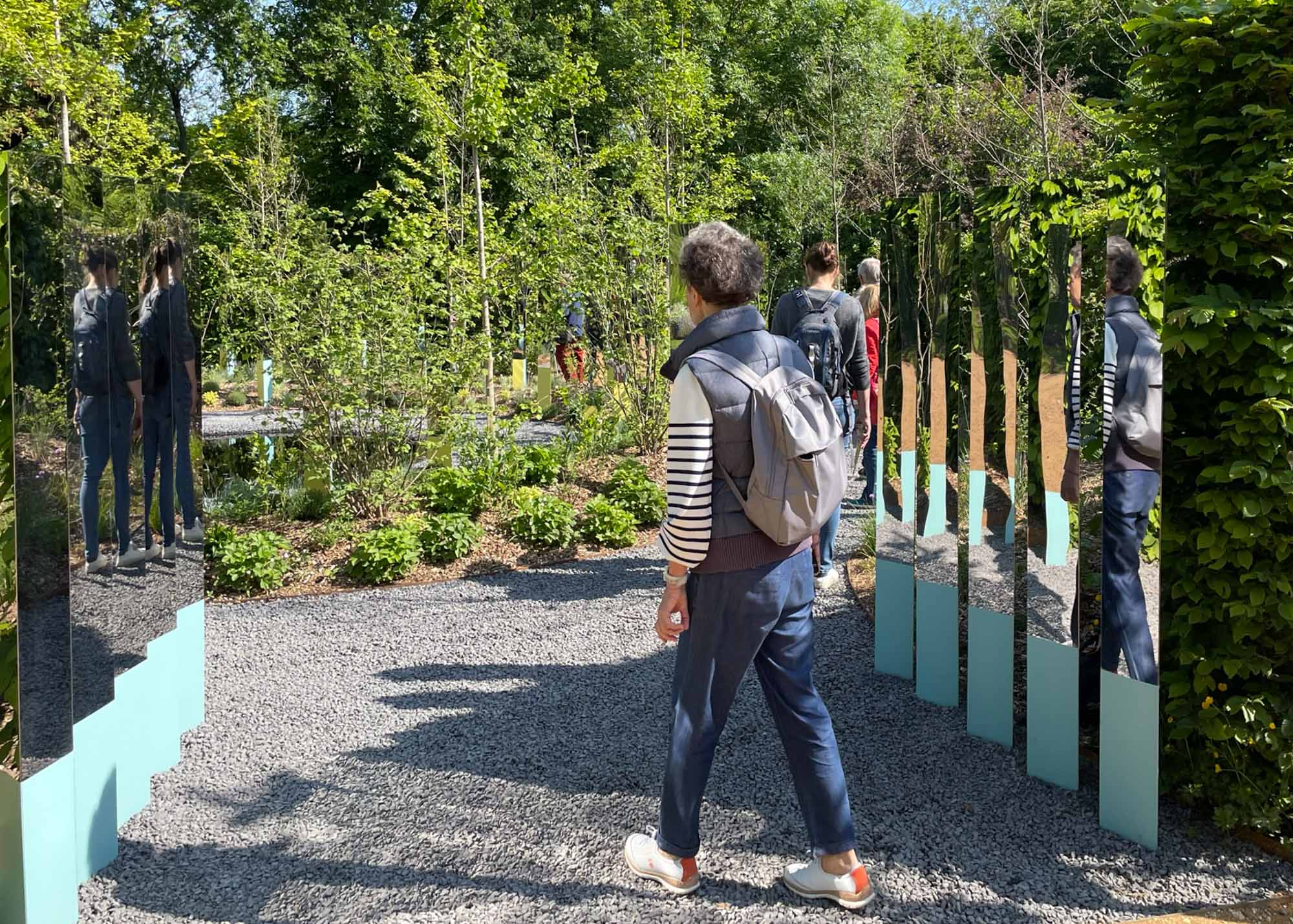 Person walking through the entry of the Garden of Reciprocity