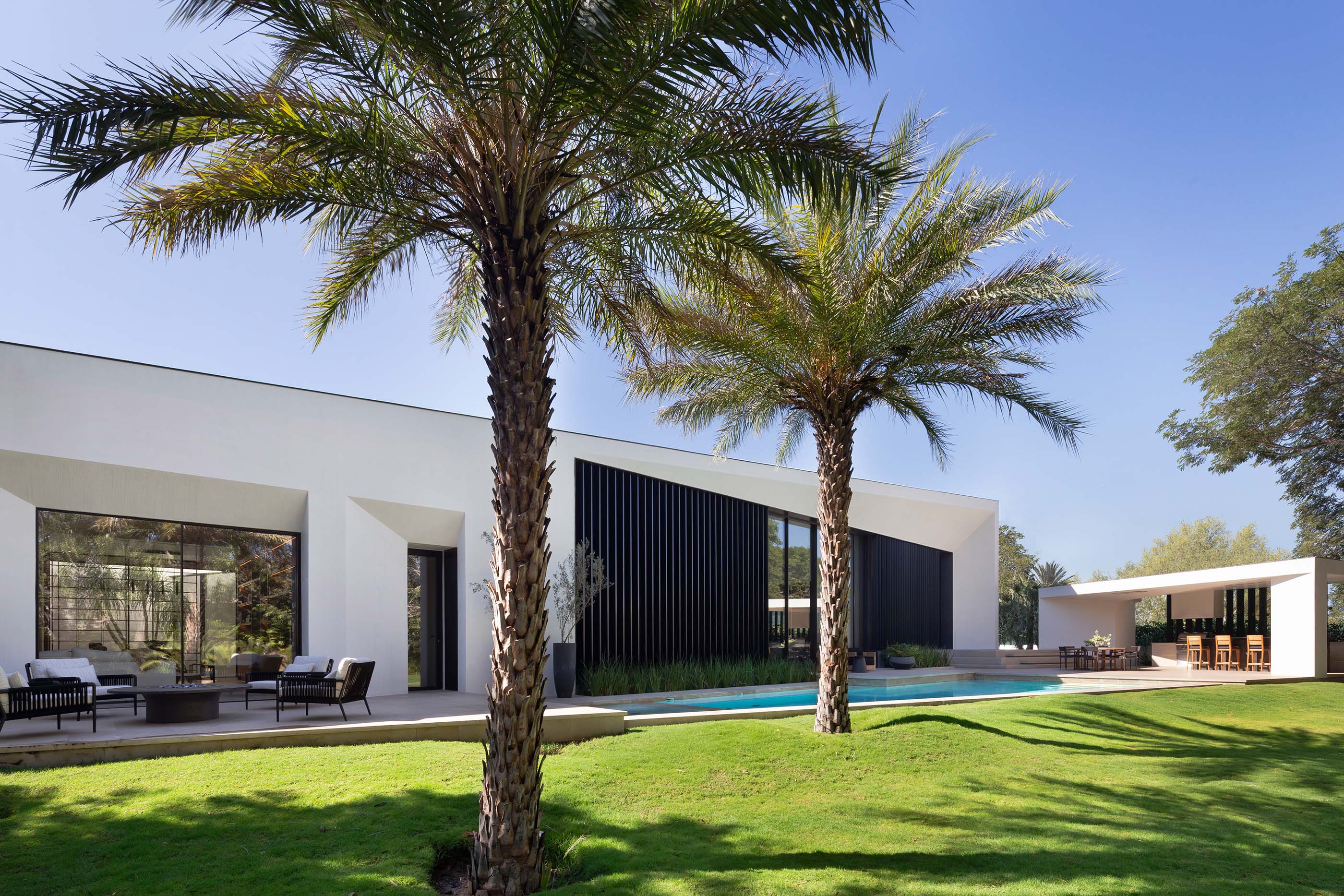 exterior of the home in the daytime revealing the home's architectural form