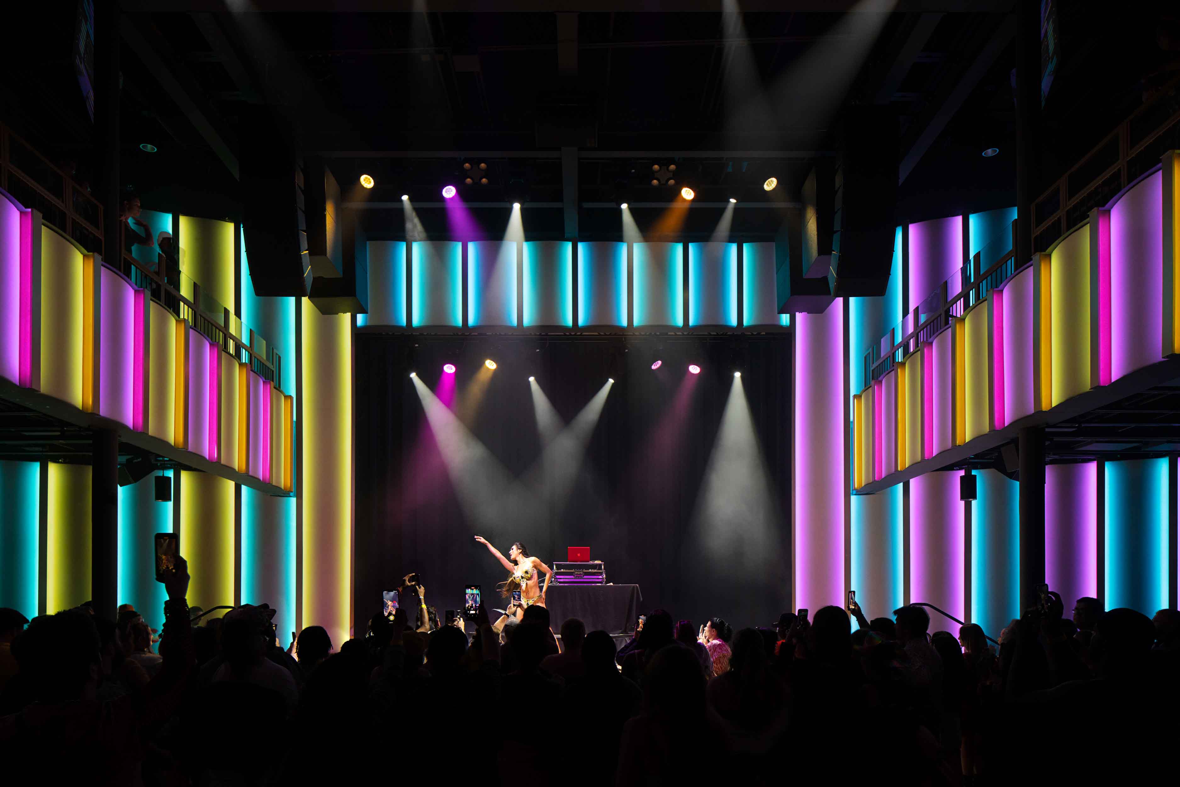 Performance stage at the Music Hall with neon lighting surrounding the stage