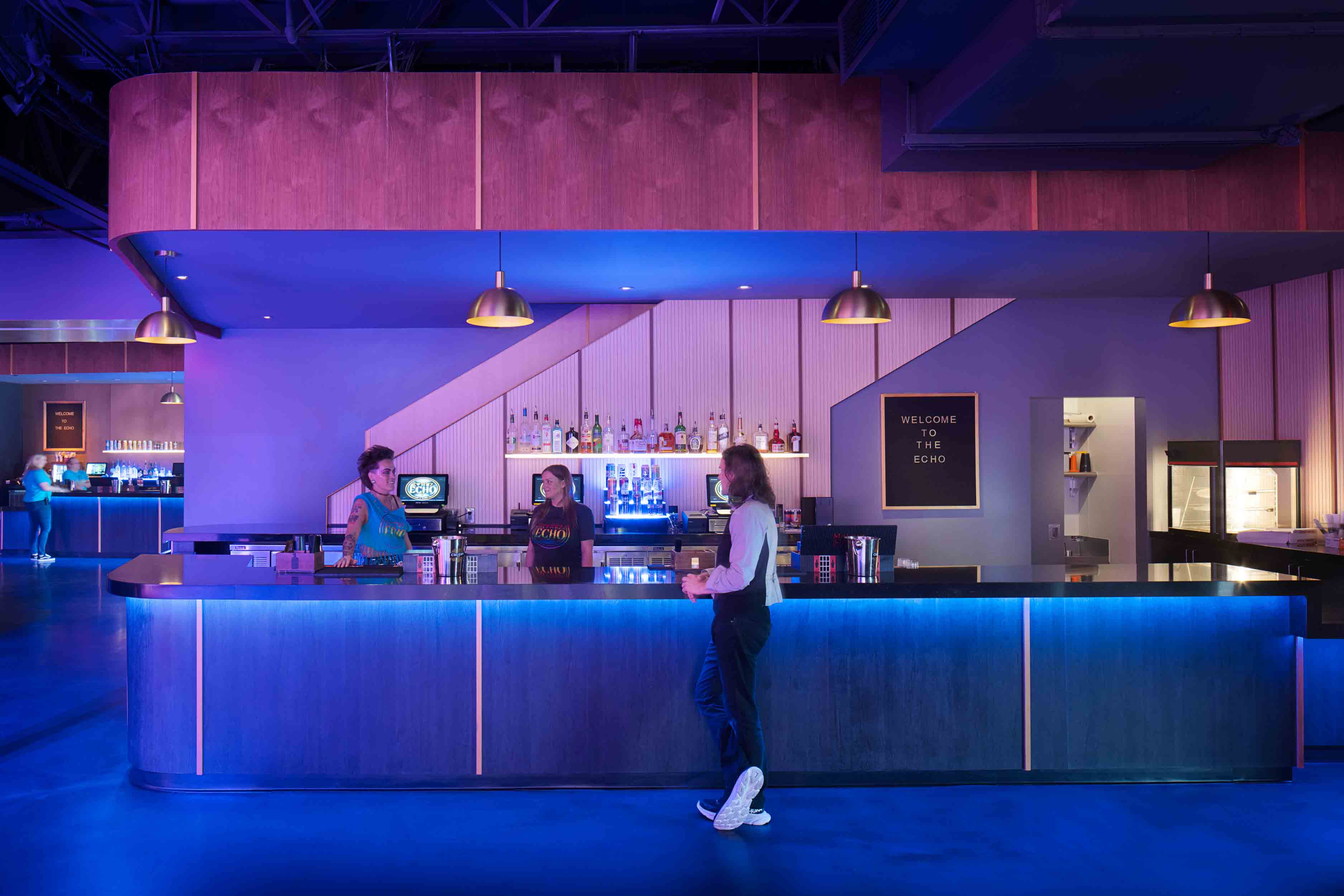 The Echo Lounge bar with vibrant blue and pink lighting