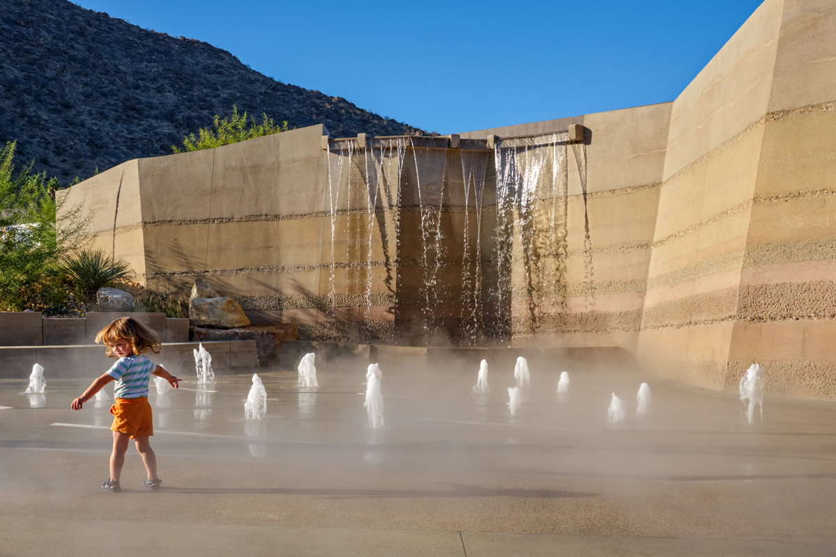 Girl playing in water feature at Palm Springs Park