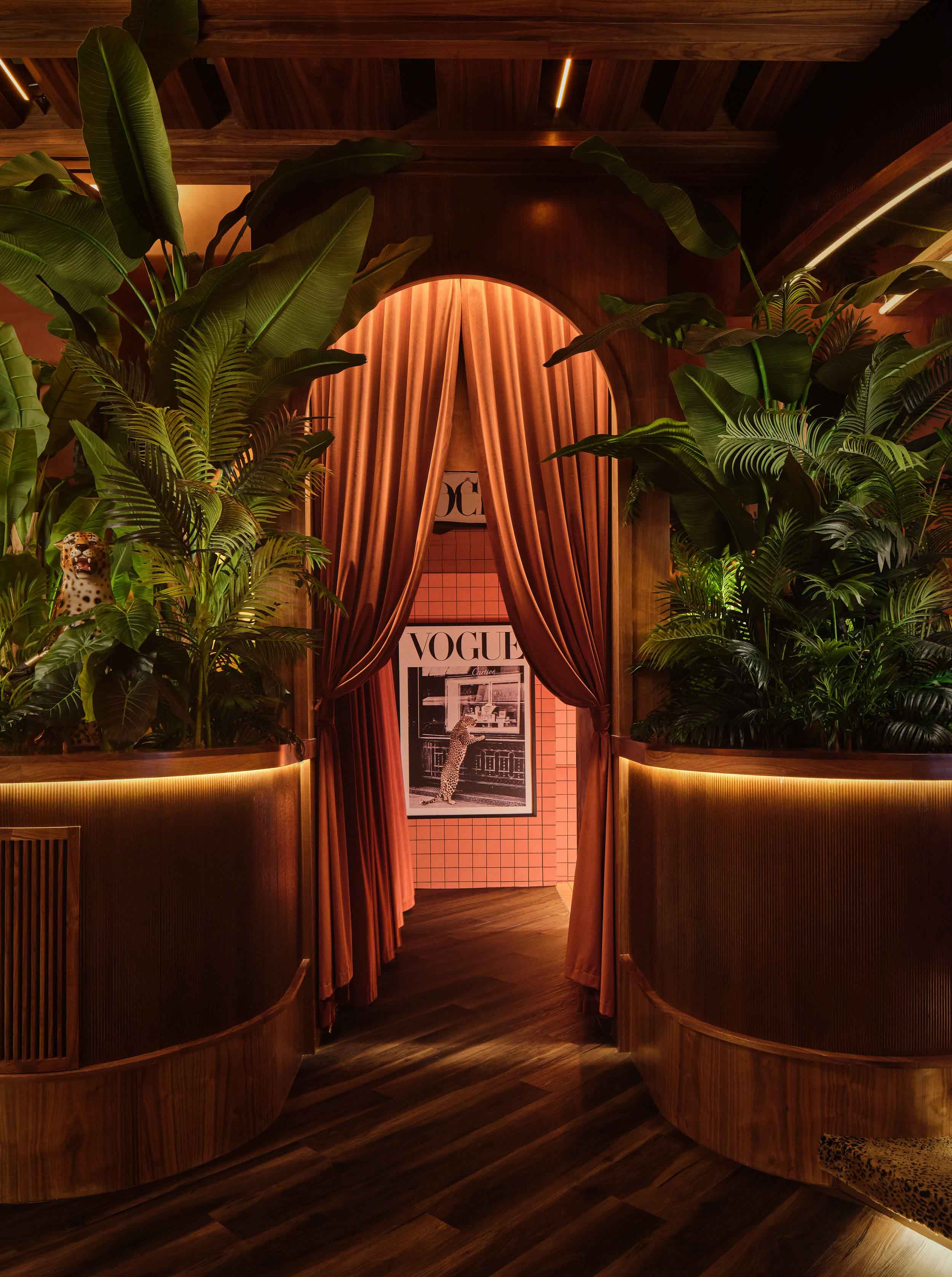 curtained entrance into pink bathroom