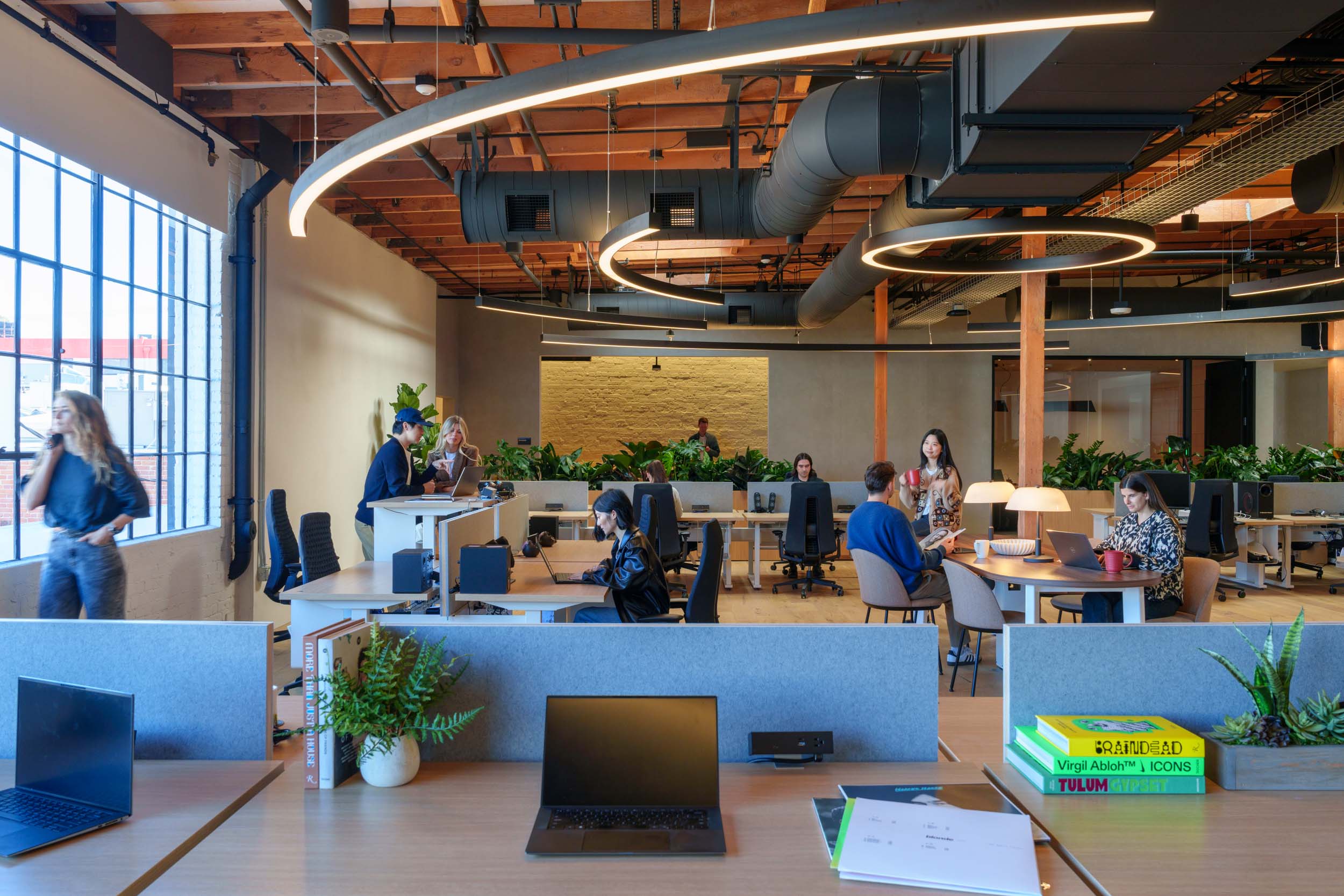 A light-filled open workspace at Sony Music Publishing supports the full spectrum of creative work / content creation workplace